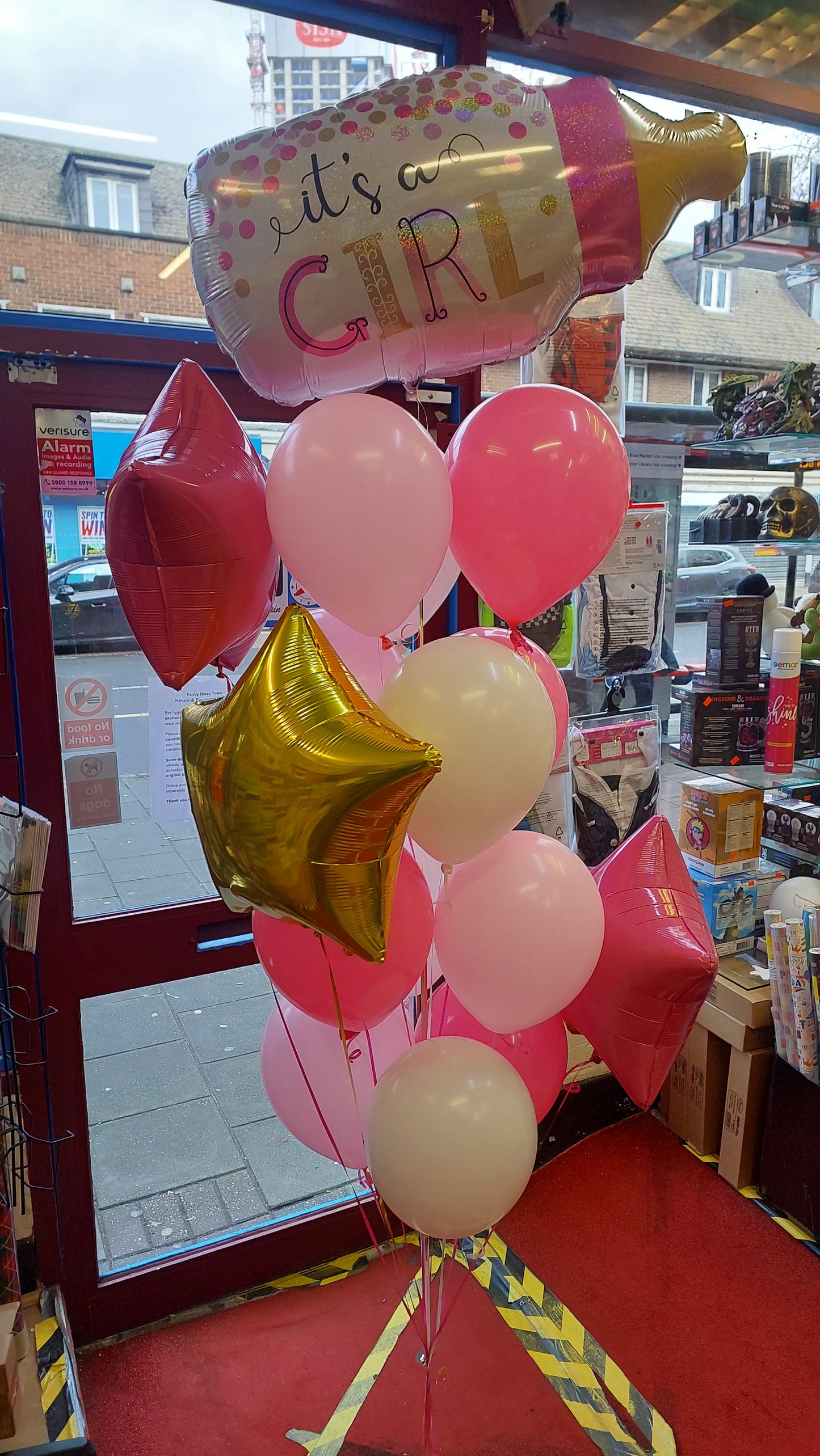 Decorative balloons with 'it's a girl' foil balloon